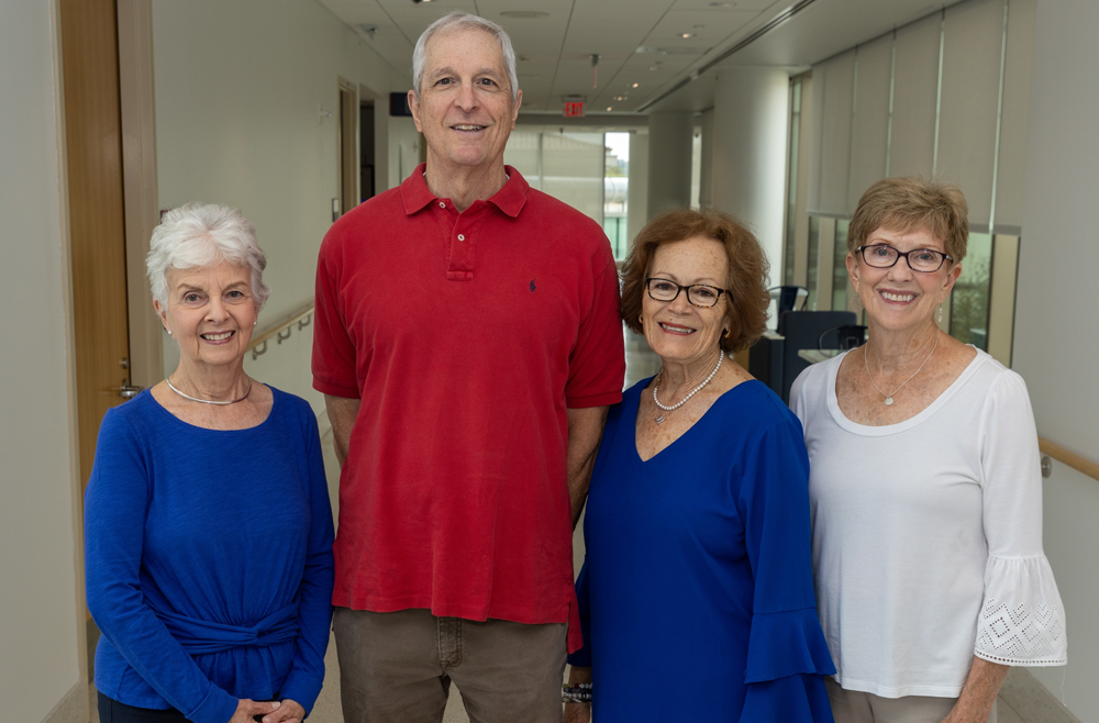 Four members from the Patient Family and Advisory Council stand together.